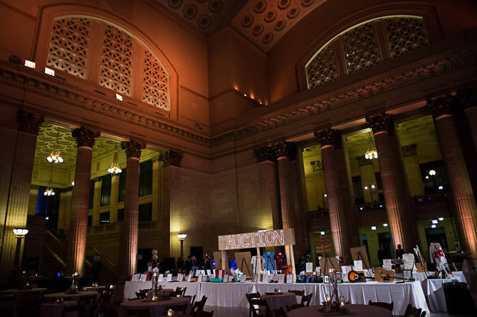 Overview of the event's auction tables in Chicago's Union Station's Great Hall.