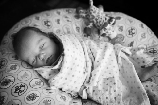 Black and white photo of adorable sleeping child.