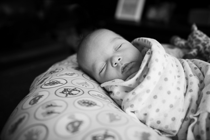 Peaceful baby black and white photo.