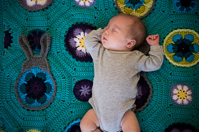 Little baby on a cute blanket.